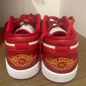 Red Air Jordan Sneakers with Gold Logo